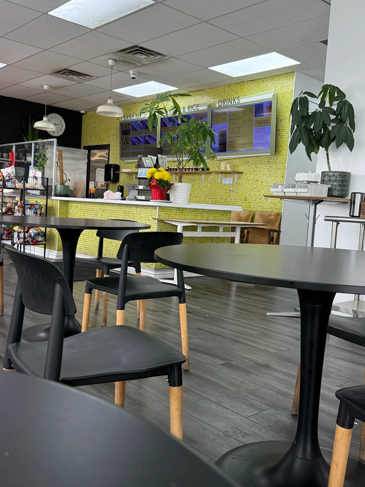 Cafe seating with the order counter and menu boards